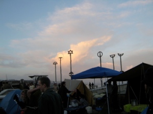 golden clouds as dusk falls over the encampment, day three